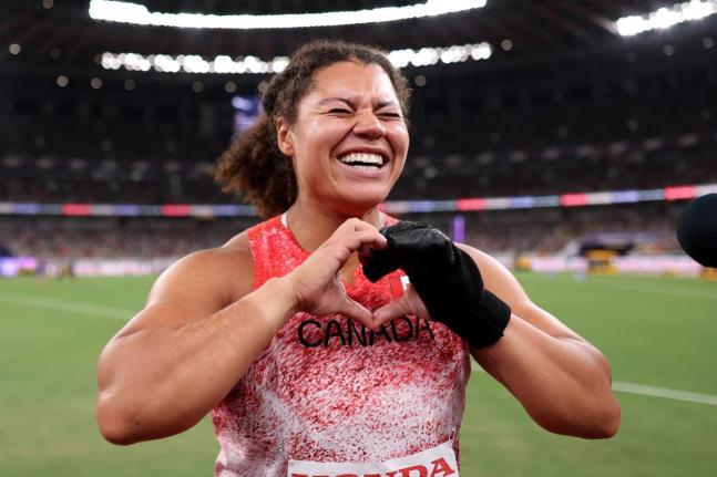 Canada’s Camryn Rogers celebrates winning gold in the Hammer Throw at the World Athletics Championships in Tokyo last year. The glove on her hand was donated to the Museum of World Athletics yesterday.