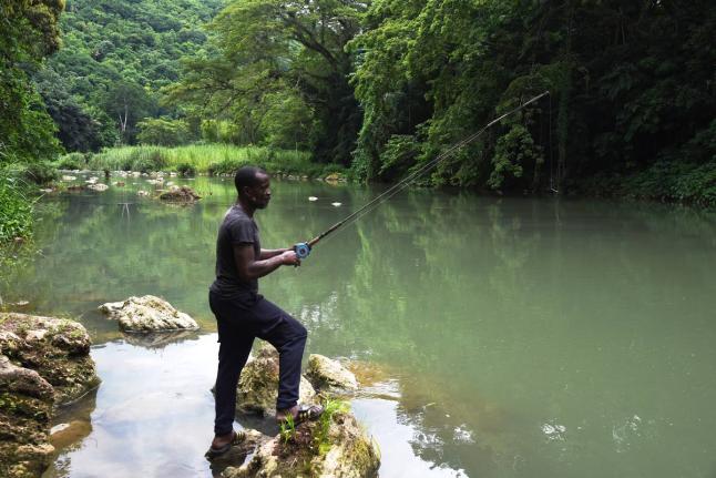File 
In this file photo Rohan Malcolm from Kent Village, St Catherine, is seen angling at Rio Cobre River.