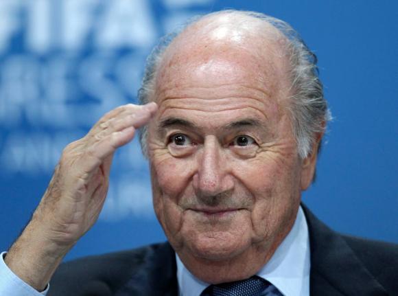 In this June 1, 2011, file photo, Sepp Blatter gestures during a press conference in Zurich, Switzerland. 
