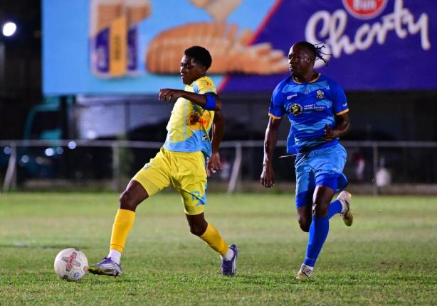 Ky-mani Campbell of Waterhouse FC (left) dribbles down field, chased by Tyrique Wilson of Molynes United FC during their Jamaica Premier League match at Waterhouse Mini Stadium on Sunday, December 28, 2025.