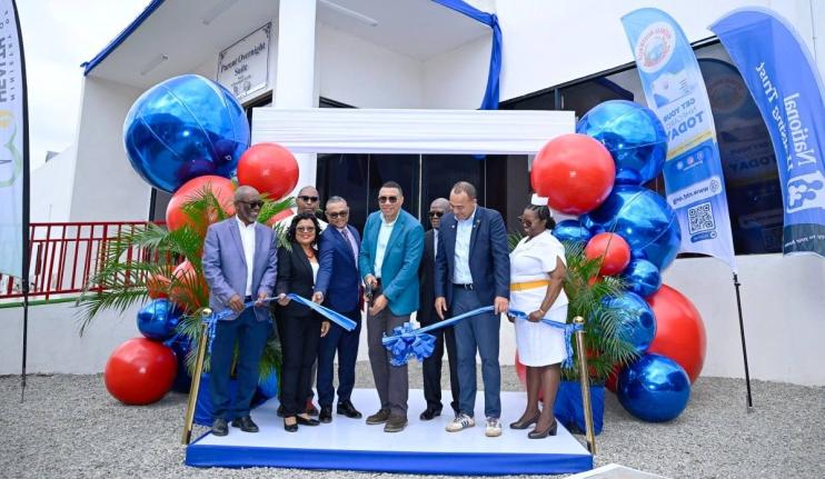 Prime Minister Dr Andrew Holness (fourth right) cuts the ribbon to officially open the new Parent Overnight Suite at the Bustamante Hospital for Children. Also pictured (from left) are Linval Freeman, NHT chairman; Dr Michelle Ann Richards-Dawson, senior m
