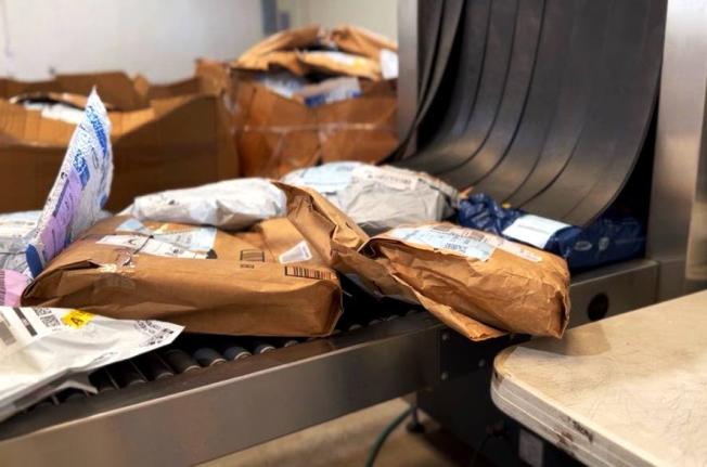 Incoming packages undergo routine scanning by Jamaica Customs at a warehouse in Kingston.