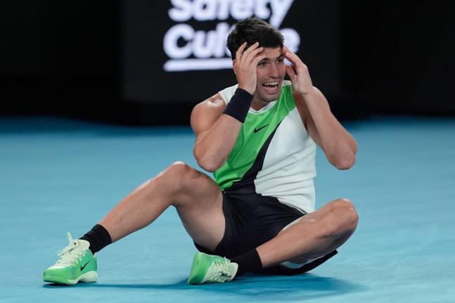 Carlos Alcaraz of Spain celebrates after defeating Novak Djokovic of Serbia in the men’s singles final at the Australian Open tennis championship in Melbourne, Australia, on Sunday.