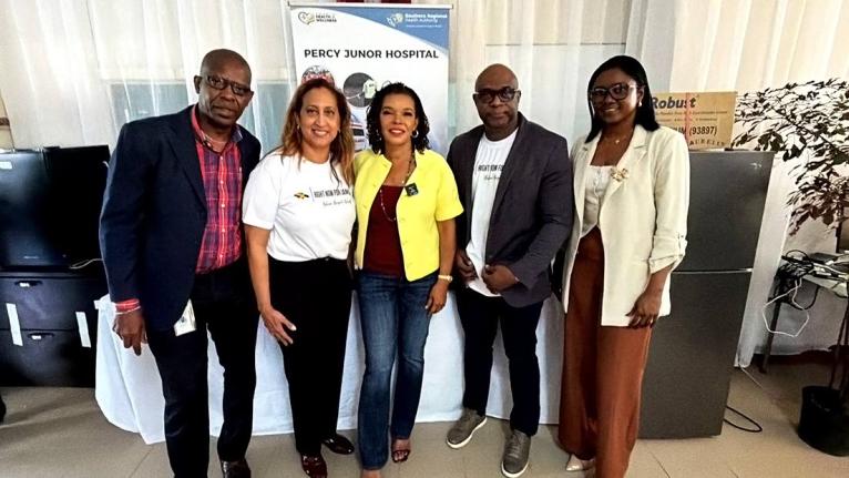 Minister without portfolio in the Office of the Prime Minister with responsibility for Efficiency, Innovation and Digital Transformation, Ambassador Audrey Marks (centre), shares a moment with (from left) Chief Executive Officer of Percy Junor Hospital, Ca