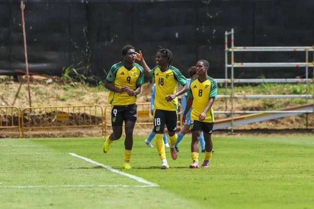From left: Jamaica Under-17’s Kelvin D Brown celebrates scoring a goal against Aruba with teammates Jude Royes and Jaheem Bennett during their Concacaf U17 Qualifier at the Costa Rica Football Federation field on February 6. Jamaica’s Under-17s became 