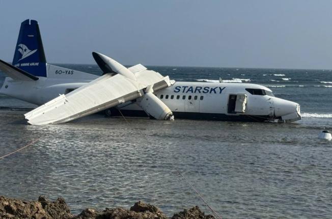 An aircraft carrying up to 50 people on the shoreline after veering off the runway during an emergency crash-landing at Somalia’s main airport in Mogadishu, Somalia, Tuesday, February, 2026.  