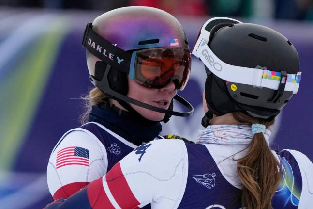 United States’ Mikaela Shiffrin (left) is hugged by United States’ Paula Moltzan at the finish area of an alpine ski, women’s team combined race, at the 2026 Winter Olympics, in Cortina d’Ampezzo, Italy, yesterday.