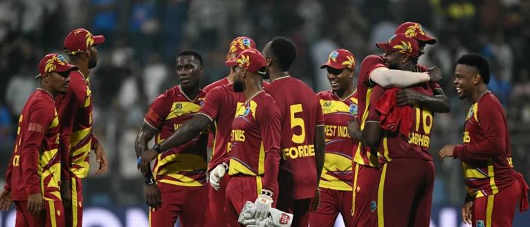 West Indies players celebrate a win over England in their second Group C ICC T20 World Cup cricket game at the Wankhede Stadium in Mumbai, India on February 11.