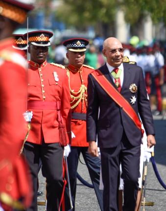 Governor General Sir Patrick Allen inspects the Guard of Honour mounted by members of the Jamaica Defence Force during the ceremonial opening of Parliament on Duke Street in downtown Kingston in 2023.