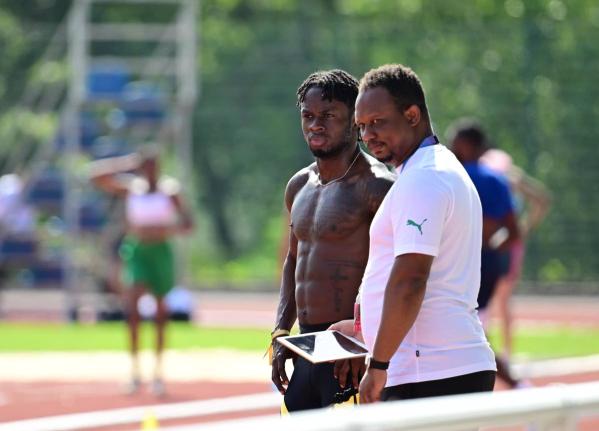 Ackeem Blake (left) and  his coach Michael Frater.