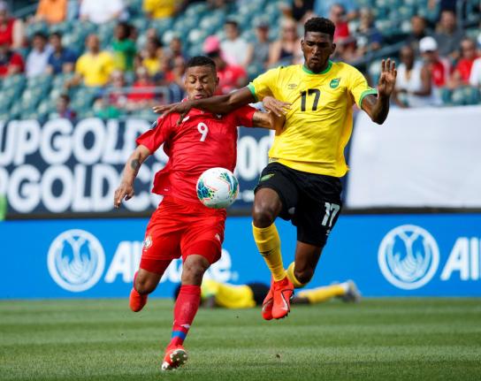 Jamaica’s Damion Lowe (right). 