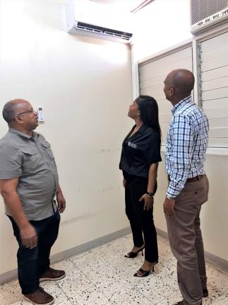 Christopher Ffrench (left), medical officer in Accident & Emergency at Kingston Public Hospital; Jhana Edwards, marketing manager at Supreme Ventures Limited; and Igol Allen, blood donor organiser, discuss the impact of the newly donated air conditioning u