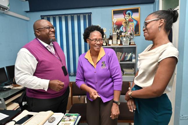 From left: Pembroke Hall High School Principal Reverend Claude Ellis; Vice-Principal of Human Resources and Operation Yvette Shields-Green and Stacy-Ann McIntosh-Richard engage in a conversation. 
