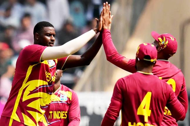 West Indies’ Jason Holder (second left) celebrates with teammates after taking the wicket of Nepal’s Aarif Sheikh (not in photo) during a T20 World Cup cricket match in Mumbai, India on February 15.
