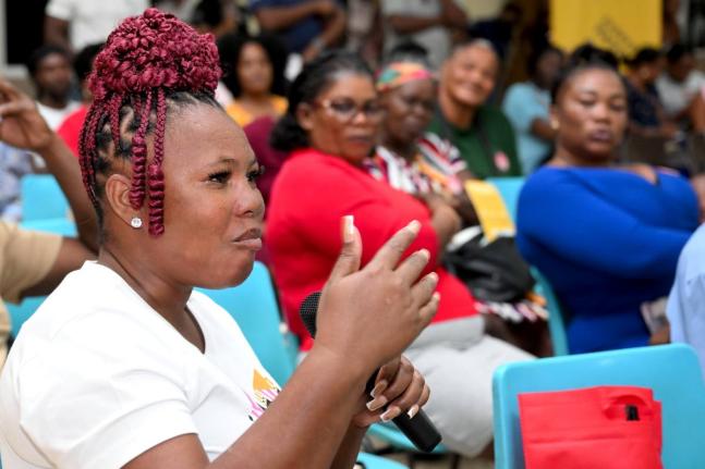 Iasha Johnson, a resident of May Pen, makes a point during a recent town hall meeting in her community organised by Project STAR.
