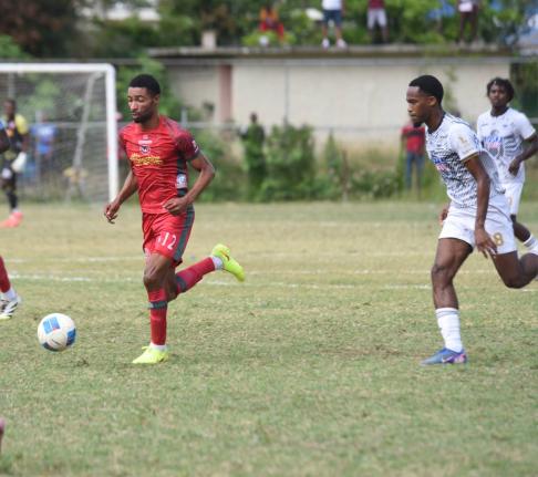 
Montego Bay United’s Timar Lewis (left) dribbles away from Cavalier SC’s Adrian Reid during a Jamaica Premier League football game at Jarrett Park in Montego Bay last Sunday.