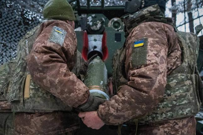 Ukrainian servicemen load an artillery shell before firing at Russian positions on the front line in Kharkiv region of Ukraine, Wednesday, February 18, 2026. (AP Photo/Andrii Marienko, File)