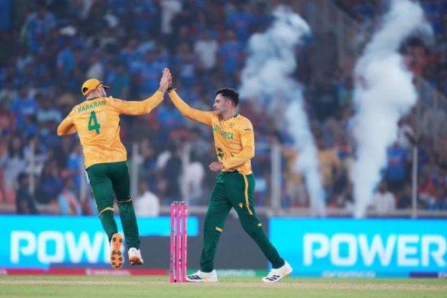 South Africa’s Keshav Maharaj (right) celebrates with captain Aiden Markram the wicket of India’s Arshdeep Singh during the T20 World Cup cricket match between India and South Africa in Ahmedabad, India, yesterday.