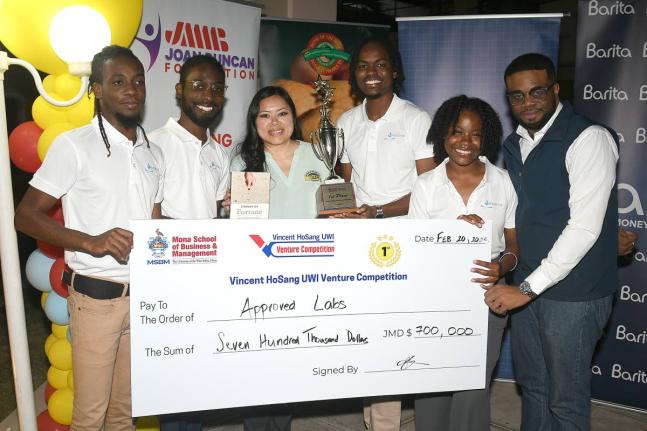 From left: Raheem Williams and Damion Henry of Approved Labs; Simone HoSang, chief operating officer of Caribbean Food Delights, title sponsor and long-standing partner of the Vincent HoSang UWI Venture Competition; Akeem Hutchinson, CEO of Approved Labs; 