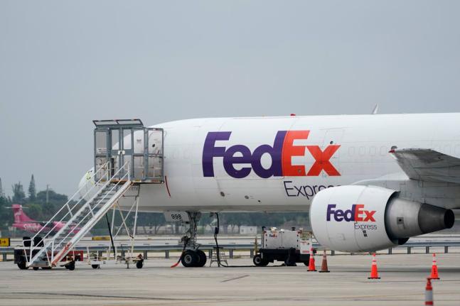 A FedEx cargo plane is shown on the tarmac at Fort Lauderdale-Hollywood International Airport, Tuesday, April 20, 2021, in Fort Lauderdale, Fla. (AP Photo/Wilfredo Lee, File)