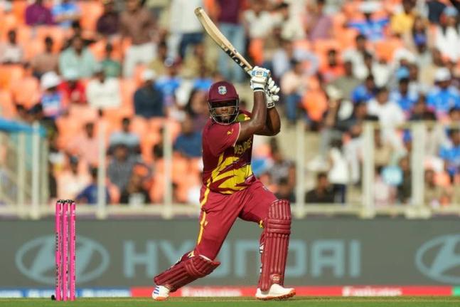 West Indies’ Romario Shepherd plays a shot during the T20 World Cup cricket match between South Africa and West Indies in Ahmedabad, India yesterday.  Shepherd made 52 not out.