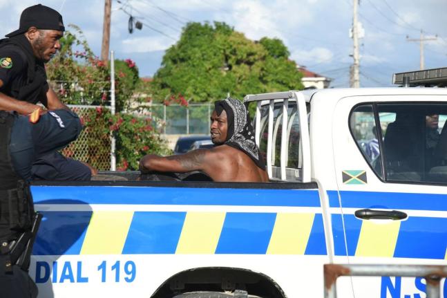 Footballer Cory Burke in police custody in January 2026.