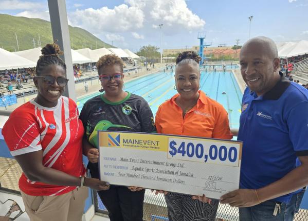 Jamaica’s coach and manager, Gillian Millwood and Georgia Sinclair (left and second left, respectively) are presented with a $400,000 sponsorship cheque by Main Event Entertainment Group’s Donna Stuart (second right) and Glendon Phillips (right) for th