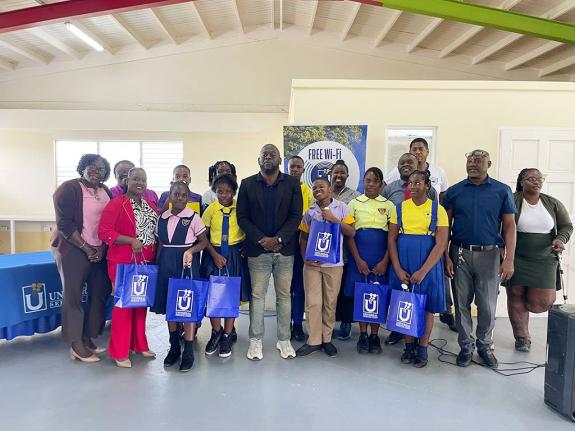 Member of Parliament for St Mary South Eastern, Christopher Brown (centre), poses with several of the awardees and their teachers. 