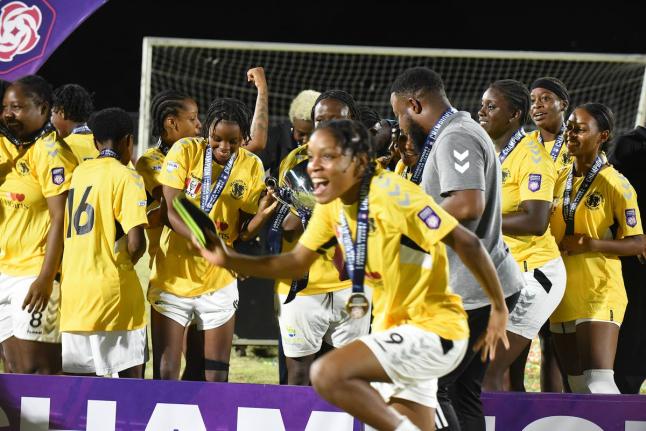 Members of Frazsiers Whip FC celebrate after winning the Jamaica Women’s Premier League football title last year.  They defeated Cavalier  4-1 in the final at Ashenheim Stadium, Jamaica College.