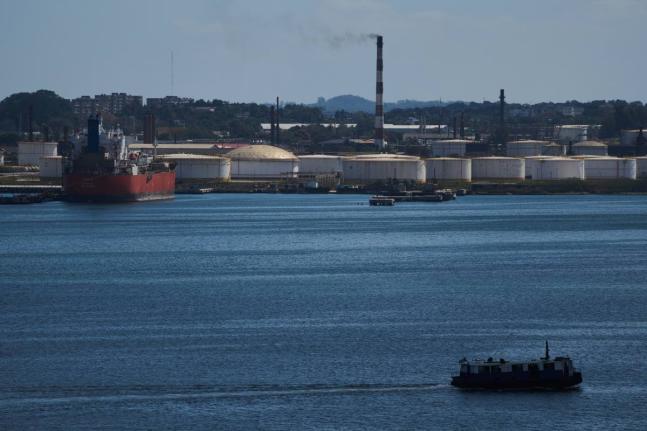 A ferry crosses Havana Bay past the Nico Lopez oil refinery where a Cuban tanker is anchored in Havana, Cuba, Thursday, February 26, 2026. 