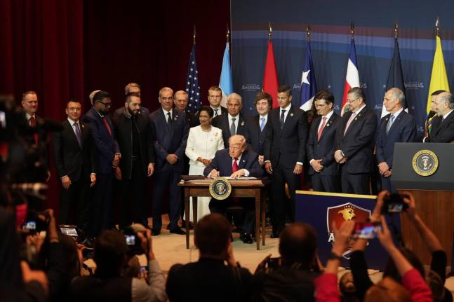 President Donald Trump signs a proclamation committing to countering cartel criminal activity at the Shield of the Americas Summit, Saturday, March 7, 2026, at Trump National Doral Miami in Doral, Florida. (AP Photo/Rebecca Blackwell)