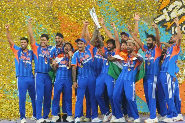 India’s players celebrate with the trophy after winning the T20 World Cup final match against New Zealand in Ahmedabad, India, on Sunday, March 8.  