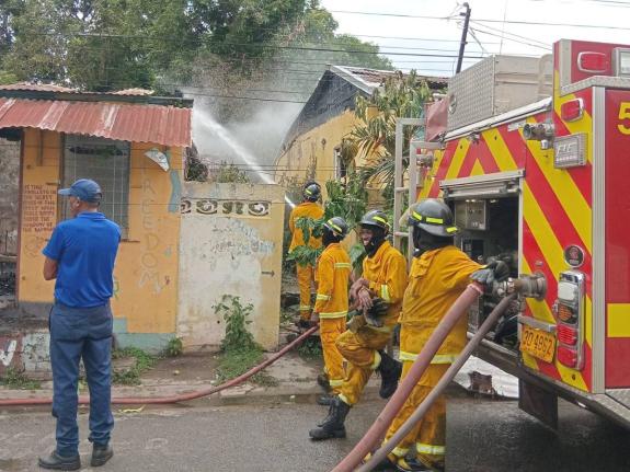 Firefighters at the scene of a fire at a property located at the intersection of Nugent Street and Old Market Street in Spanish Town, St Catherine on March 9, 2026.