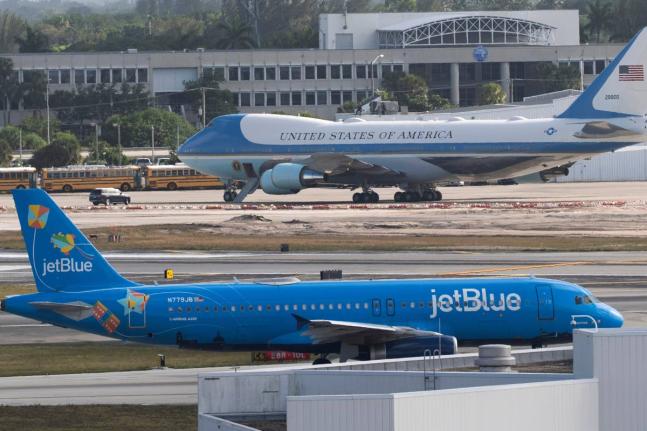 A JetBlue passenger jet, front, taxis at Palm Beach International Airport, Sunday, March 30, 2025, in West Palm Beach, Fla. (AP Photo/Manuel Balce Ceneta, File)