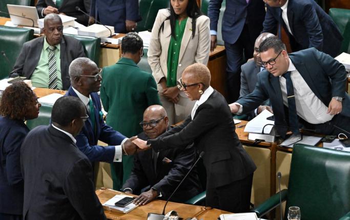 Government members of the House of Representatives congratulate Fayval Williams, minister of finance and the public service, after she opened the 2026-2027 Budget Debate at Gordon House yesterday.