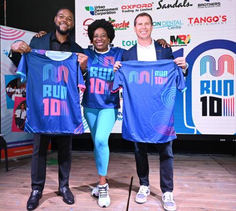 From left: Richard Vernon, the mayor of Montego Bay; Janet Silvera, chairperson of the Jill Stewart MoBay City Run (JSMCR); and Adam Stewart, executive chairman of Sandals Resorts International, display jerseys to be worn by participants in the annual even