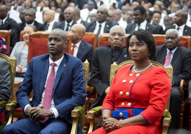 Haiti's President Jovenel Moise sits with his wife Martine during his swearing-in ceremony at Parliament in Port-au-Prince, Haiti, Tuesday February 7, 2017.  (AP Photo/Dieu Nalio Chery, File)