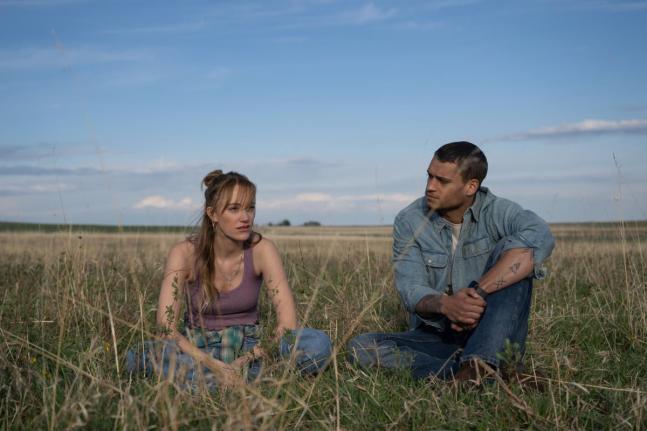 This image released by Universal Pictures shows Maika Monroe, and Tyriq Withers in a scene from ‘Reminders of Him’.