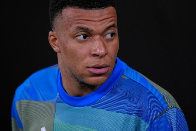 Real Madrid's Kylian Mbappe looks on before the Spanish La Liga soccer match between Real Madrid and Atletico Madrid in Madrid, Spain, Sunday, March 22, 2026. 