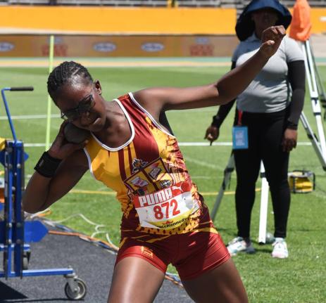 Port Antonio’s Xavier Jones gets ready to throw during the Class 2 Girls’ shot put on yesterday’s opening day at the ISSA/GraceKennedy Boys and Girls’ Athletics Championships at the National Stadium.