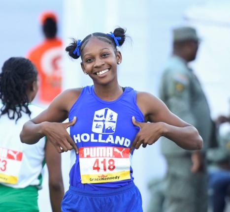 Holland High School’s Shanoya Douglas was relaxed after winning her Class 1 100-metre heat at yesterday’s ISSA/GraceKennedy Boys and Girls’ Athletics Championships inside the National Stadium yesterday.