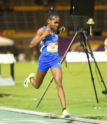 Alexjordan Hall of Clarendon College wins the  Class Three girls 1500 metres final during the second day of the  2026 ISSA/GraceKennedy Boys and Girls’ Athletics Championships at the National Stadium.